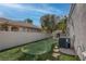 Backyard putting green adds recreational fun to this home's exterior at 4594 Blue Mesa Way, Las Vegas, NV 89129