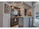 The wet bar features a stylish design, granite countertops, and convenient wine storage at 4594 Blue Mesa Way, Las Vegas, NV 89129