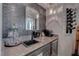 A sophisticated wet bar with a stylish backsplash, granite counters, and wine storage at 4594 Blue Mesa Way, Las Vegas, NV 89129