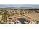 Aerial view of a community with a park, desert landscaping, and mountain views at 4624 Leon De Oro Dr, Las Vegas, NV 89129