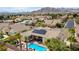 The aerial view reveals a home with solar panels, a pool, and well-maintained landscaping at 4624 Leon De Oro Dr, Las Vegas, NV 89129