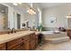 A spacious bathroom features dual vanities, a soaking tub, and decorative accents at 4624 Leon De Oro Dr, Las Vegas, NV 89129