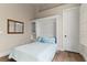 Charming bedroom with a cozy bed and a stylish built-in cabinet and a wooden floor at 4624 Leon De Oro Dr, Las Vegas, NV 89129