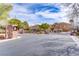 Gated community entrance with secure access, featuring well-maintained landscaping and elegant architectural details at 4624 Leon De Oro Dr, Las Vegas, NV 89129