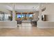 Bright dining room with modern lighting, hardwood floors, and large windows overlooking the backyard at 4624 Leon De Oro Dr, Las Vegas, NV 89129