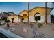 Beautiful home exterior boasting desert landscaping, stone accents, and a welcoming entrance at 4624 Leon De Oro Dr, Las Vegas, NV 89129