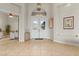 Inviting foyer with tile flooring, high ceilings, and elegant lighting fixture at 4624 Leon De Oro Dr, Las Vegas, NV 89129