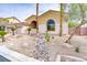 Attractive single-story home with desert landscaping, rock features, and a well-maintained exterior at 4624 Leon De Oro Dr, Las Vegas, NV 89129