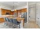 Kitchen featuring an island with bar seating, stainless steel appliances, and plenty of counter space at 4624 Leon De Oro Dr, Las Vegas, NV 89129