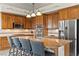 Spacious kitchen featuring an island with seating, stainless steel appliances, and ample counter space at 4624 Leon De Oro Dr, Las Vegas, NV 89129