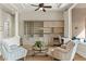 Comfortable living room with built-in shelving, a glass coffee table, and two armchairs at 4624 Leon De Oro Dr, Las Vegas, NV 89129