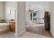 Bedroom with a big window, wooden floors and a bathtub at 4624 Leon De Oro Dr, Las Vegas, NV 89129