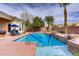 Backyard pool and patio area featuring a cascading water feature and blue accents at 4624 Leon De Oro Dr, Las Vegas, NV 89129
