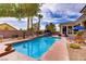 Sparkling pool area with a sunbathing deck, creating a serene and private oasis for outdoor enjoyment at 4624 Leon De Oro Dr, Las Vegas, NV 89129