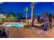 Luxurious backyard pool with spa, desert landscaping, and covered lounge area perfect for relaxation at 4624 Leon De Oro Dr, Las Vegas, NV 89129