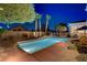 Relaxing pool area with lush landscaping and ambient lighting for evening enjoyment at 4624 Leon De Oro Dr, Las Vegas, NV 89129