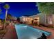 Backyard with pool featuring manicured landscaping, a relaxing retreat at 4624 Leon De Oro Dr, Las Vegas, NV 89129