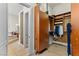 Open view of a walk-in closet, leading to bathroom with soaking tub and shower at 4624 Leon De Oro Dr, Las Vegas, NV 89129