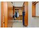 Spacious walk-in closet featuring custom wood storage and shelving for optimal organization at 4624 Leon De Oro Dr, Las Vegas, NV 89129