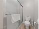 Bathroom with a shower and glass doors and white toilet at 4865 S Torrey Pines Dr # 206, Las Vegas, NV 89103