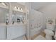 Bathroom featuring dual mirrors, vanity, lighting, and a shower with tub at 4865 S Torrey Pines Dr # 206, Las Vegas, NV 89103