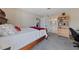 Bedroom featuring a comfortable bed, desk, and access to the bathroom at 4865 S Torrey Pines Dr # 206, Las Vegas, NV 89103