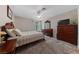 Cozy bedroom with ceiling fan, window, neutral colors, and carpet at 4865 S Torrey Pines Dr # 206, Las Vegas, NV 89103