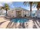 Community pool area with hot tub, palm trees, and lounging chairs at 4865 S Torrey Pines Dr # 206, Las Vegas, NV 89103