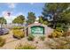 Community entrance sign amid colorful landscaping and shrubbery at 4865 S Torrey Pines Dr # 206, Las Vegas, NV 89103