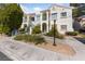 Inviting two-story condo building with landscaped grounds and a walkway leading to the entrance at 4865 S Torrey Pines Dr # 206, Las Vegas, NV 89103