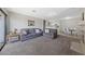 Open-concept living area with neutral carpet, comfortable seating, fireplace, and seamless transition to dining and kitchen at 4865 S Torrey Pines Dr # 206, Las Vegas, NV 89103
