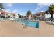 Community pool surrounded by lounge chairs and palm trees, offering a relaxing outdoor space for residents at 4865 S Torrey Pines Dr # 206, Las Vegas, NV 89103