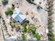 Expansive property showcasing a charming home, mature trees, and ample outdoor space at 5081 Riata Pl, Pahrump, NV 89060