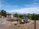 Large backyard with a generator on a trailer, surrounded by trees and with a shed on the left at 5081 Riata Pl, Pahrump, NV 89060