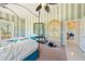 Comfortable bedroom featuring unique decor, ceiling fan, and lots of natural light at 5081 Riata Pl, Pahrump, NV 89060