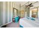 Spacious bedroom with unique striped walls, ceiling fan, and furniture at 5081 Riata Pl, Pahrump, NV 89060