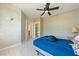 Simple bedroom with tile floors, ceiling fan, closet, and a tranquil atmosphere at 5081 Riata Pl, Pahrump, NV 89060