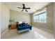 Bedroom featuring neutral tones, tiled flooring, a ceiling fan, and a bright window at 5081 Riata Pl, Pahrump, NV 89060