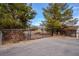 A secured entry gate with decorative accents, offering privacy and leading to a secluded home at 5081 Riata Pl, Pahrump, NV 89060