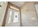 Entryway with damaged wall, front door and decorative glass, needing repairs at 5081 Riata Pl, Pahrump, NV 89060