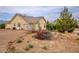 Exterior elevation showcasing desert landscaping, the garage and a well-maintained facade at 5081 Riata Pl, Pahrump, NV 89060