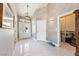 Foyer with tiled floor, art on the wall, entry door, and a view into a closet at 5081 Riata Pl, Pahrump, NV 89060