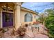 Charming front porch features stone flooring, a decorative door, and ample space for seating at 5081 Riata Pl, Pahrump, NV 89060