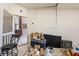 View from garage into home with crack in wall, messy interior and doorway at 5081 Riata Pl, Pahrump, NV 89060
