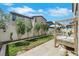 Landscaped backyard with a decorative bed, grass, stucco wall, and an ornamental outdoor bed at 513 Monarch Ridge Ct, North Las Vegas, NV 89084