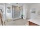 Contemporary bathroom featuring a glass enclosed shower, modern fixtures, and neutral tile at 513 Monarch Ridge Ct, North Las Vegas, NV 89084
