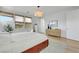 Inviting bedroom features a large window, and a neutral color scheme at 513 Monarch Ridge Ct, North Las Vegas, NV 89084