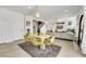 Spacious open-plan dining area offering views to the living room and staircase, with stylish light fixtures at 513 Monarch Ridge Ct, North Las Vegas, NV 89084