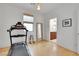 Bright exercise room with treadmill, mirror, and hardwood floor at 513 Monarch Ridge Ct, North Las Vegas, NV 89084