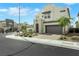 Modern home featuring desert landscaping, and a gray garage door, located in a neighborhood at 513 Monarch Ridge Ct, North Las Vegas, NV 89084